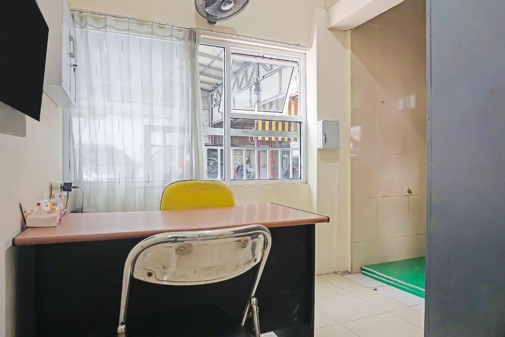 TV a/nebo společenská místnost v ubytování Super OYO Capital O 91790 S1 Residence