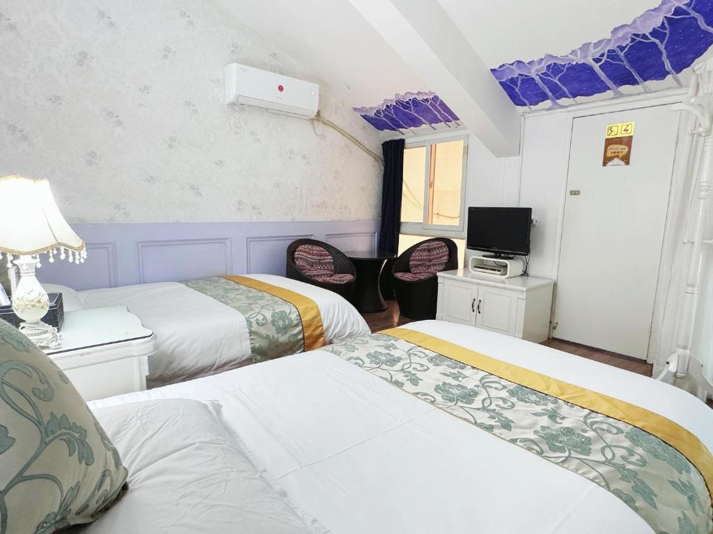 Gulta vai gultas numurā naktsmītnē Gulangyu Yuanzhongyuan Homestay