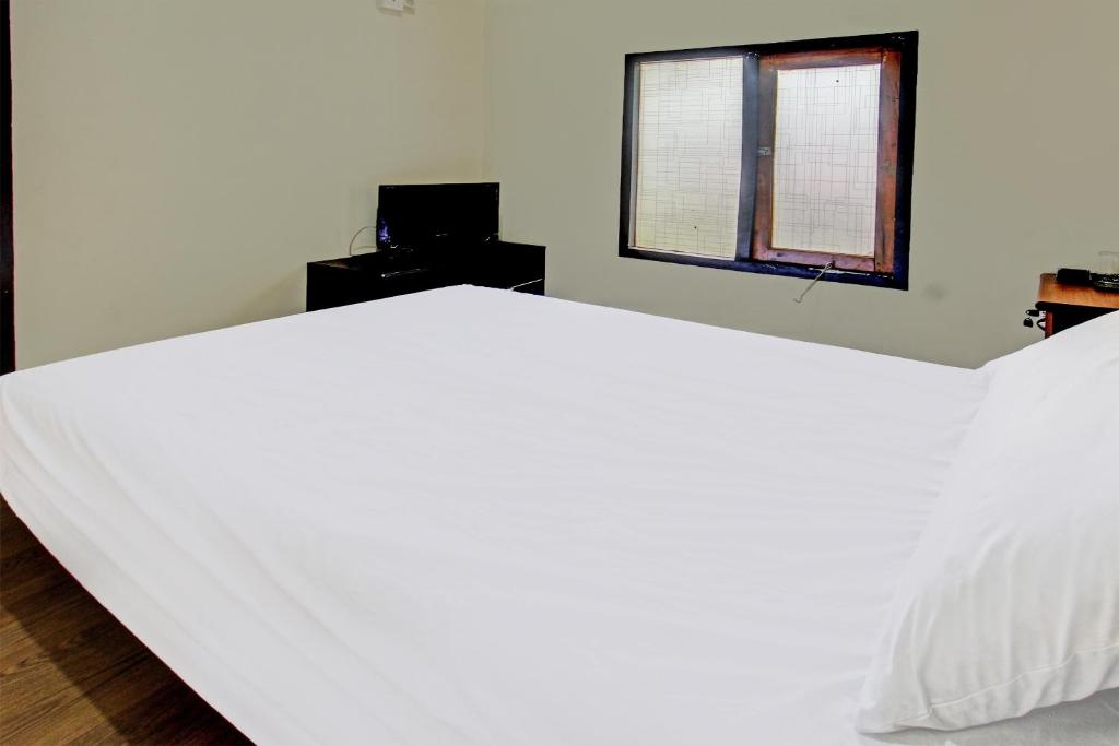 Postel nebo postele na pokoji v ubytování OYO 91830 Hotel Gemilang 2NearBukit Pergasingan