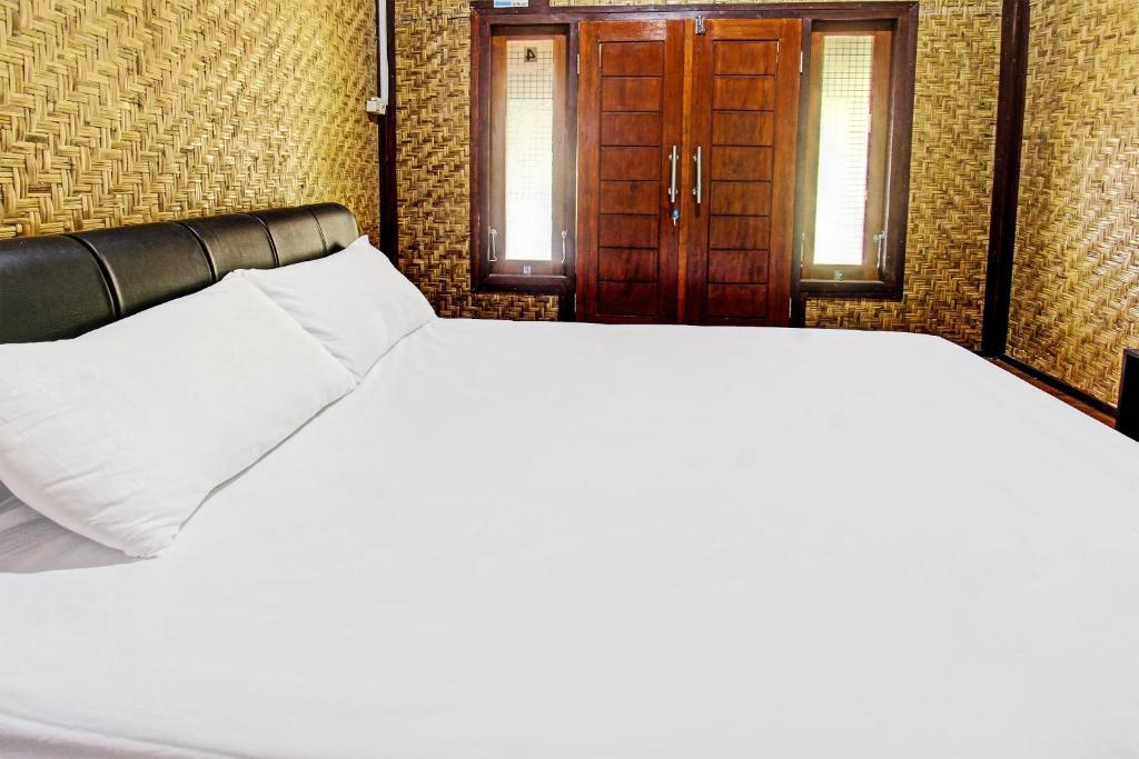 Postel nebo postele na pokoji v ubytování OYO 91830 Hotel Gemilang 2NearBukit Pergasingan