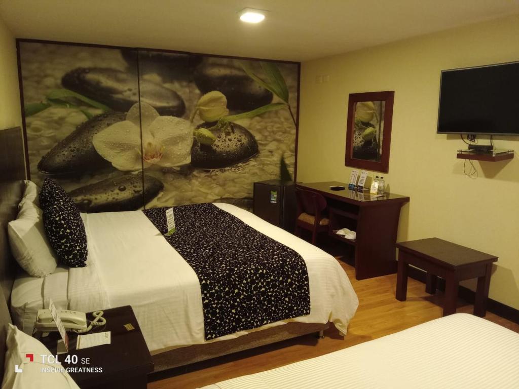 Postel nebo postele na pokoji v ubytování Loft Hotel