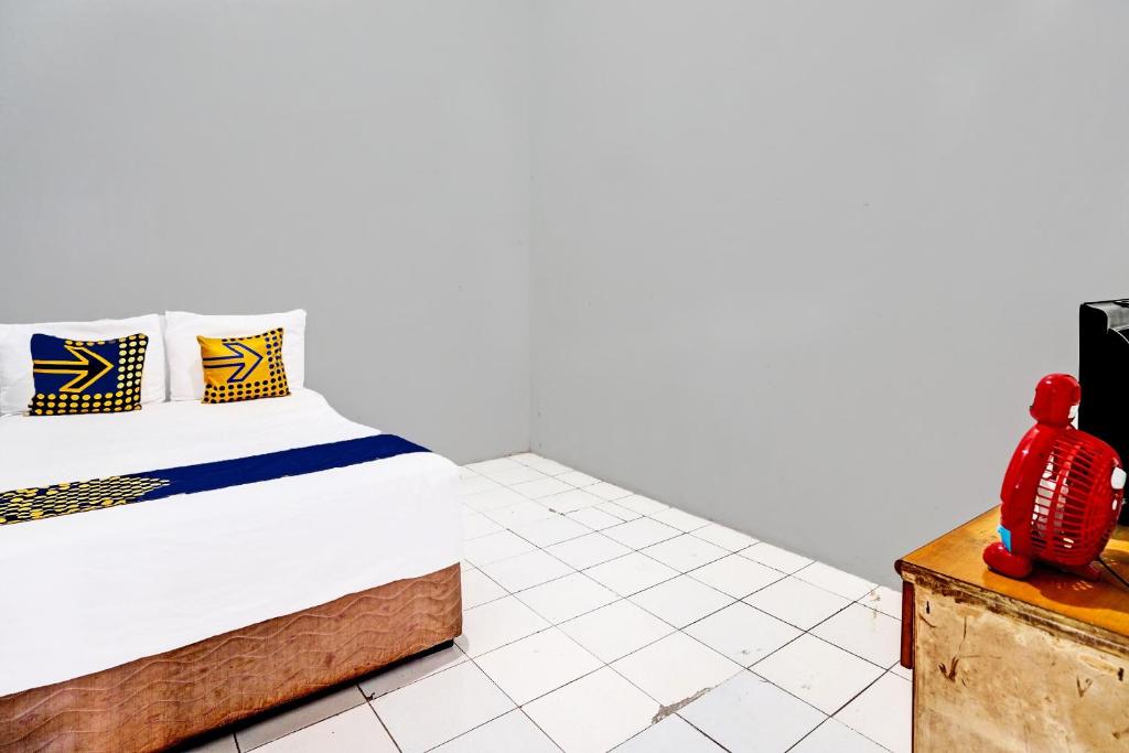 Postel nebo postele na pokoji v ubytování OYO 91891 B41m Residence Syariah