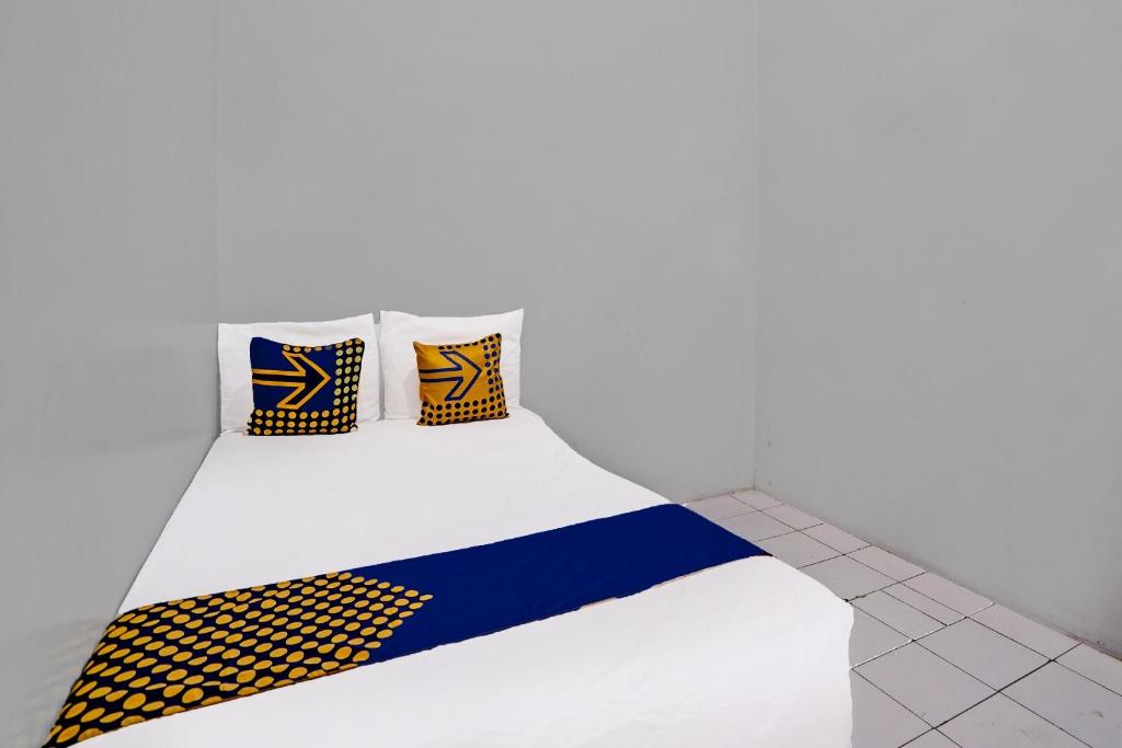 Postel nebo postele na pokoji v ubytování OYO 91891 B41m Residence Syariah