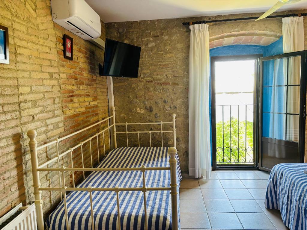 Postel nebo postele na pokoji v ubytování Can Mas