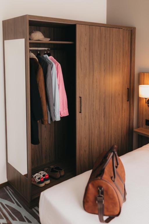 Postel nebo postele na pokoji v ubytování IIP Apartments - Self Check-In