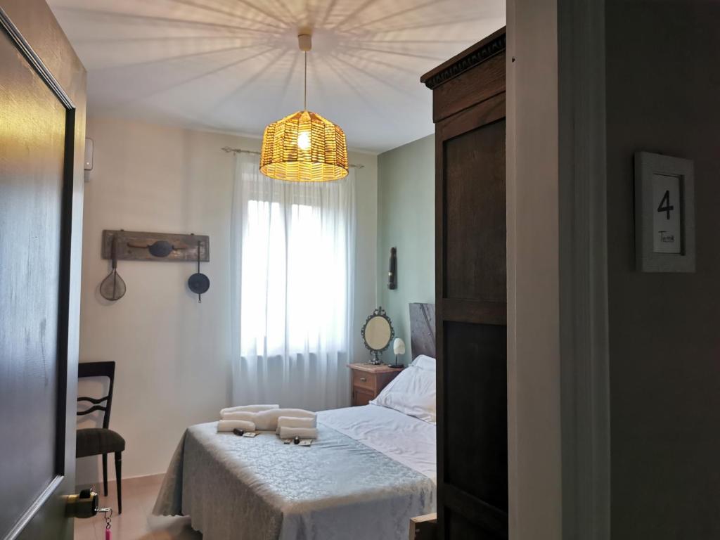 Posteľ alebo postele v izbe v ubytovaní Locanda Tanè