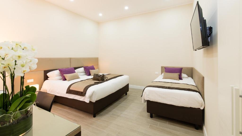 A bed or beds in a room at Bloom Apartment by La Griffe