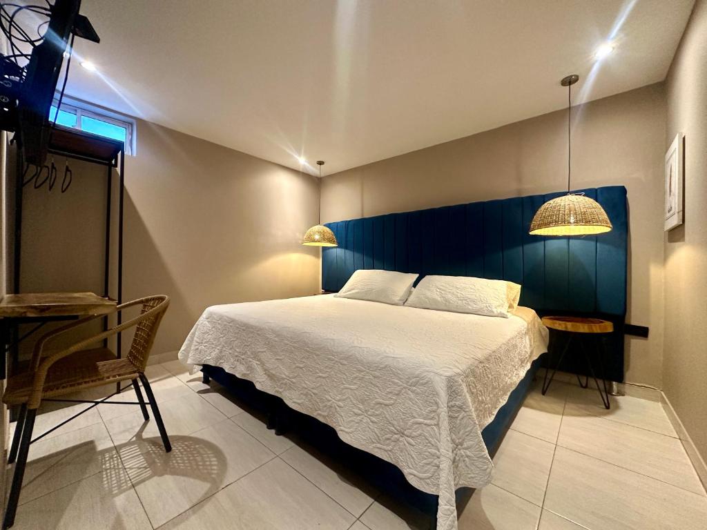 Postel nebo postele na pokoji v ubytování Hotel Londres