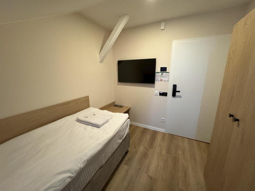 Postel nebo postele na pokoji v ubytování Promenaden Hotel