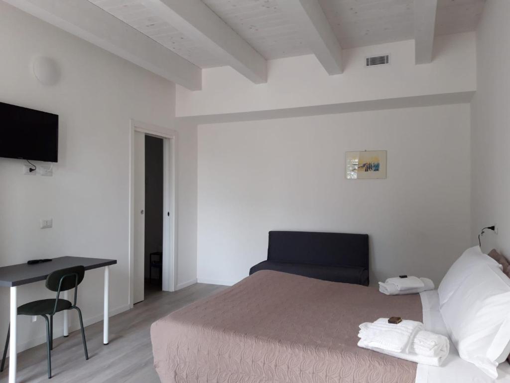 Posteľ alebo postele v izbe v ubytovaní Country House-B&B-Appartamenti Ai Cipressi