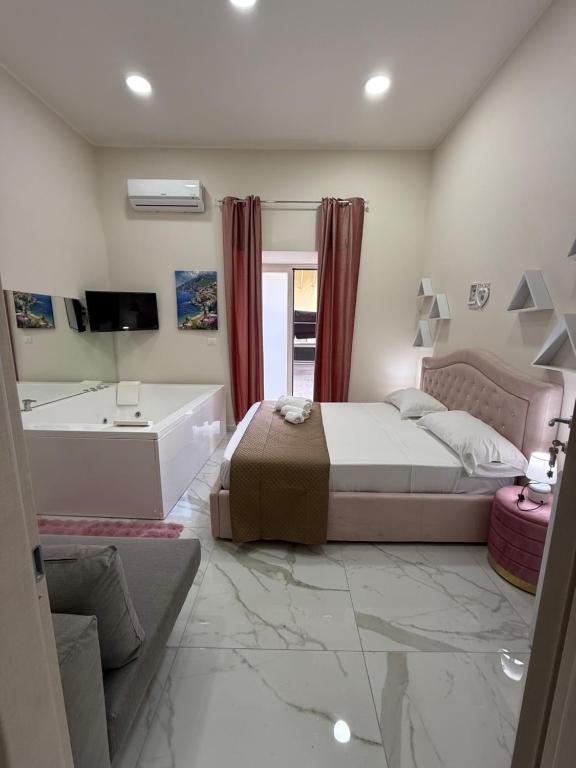 Giường trong phòng chung tại Valentino suites&terrace