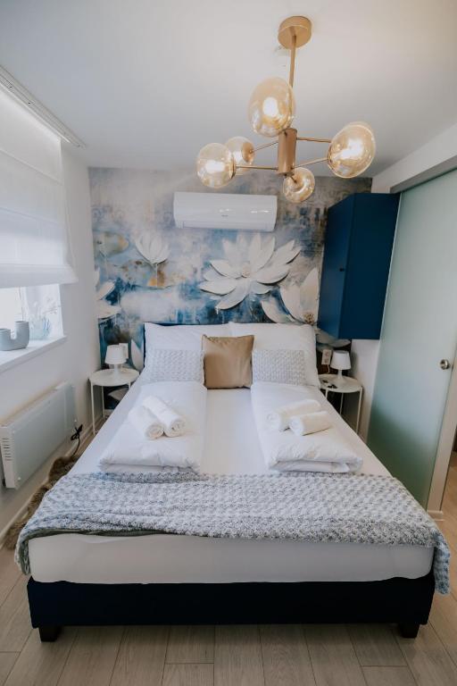Postel nebo postele na pokoji v ubytování Maison de Luxe