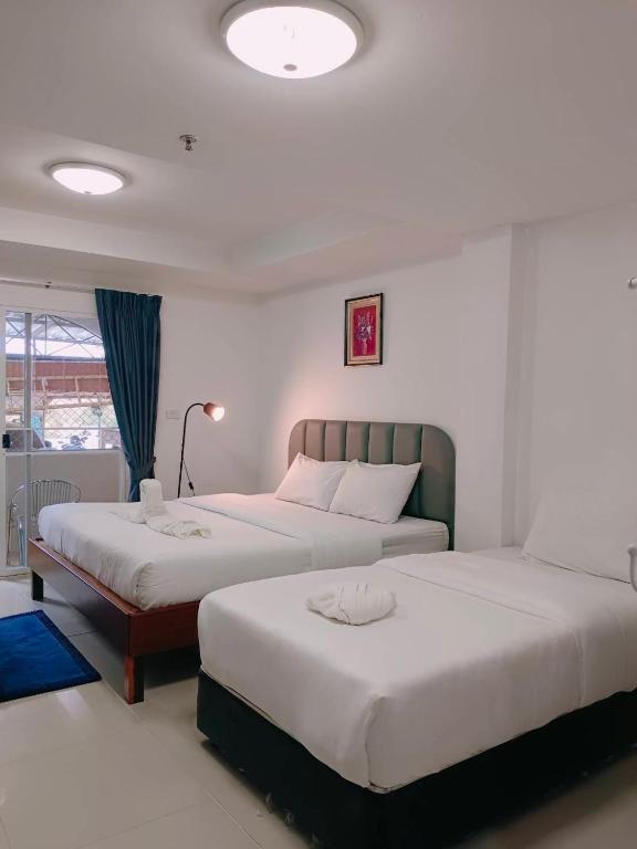 Postel nebo postele na pokoji v ubytování Convenient Resort