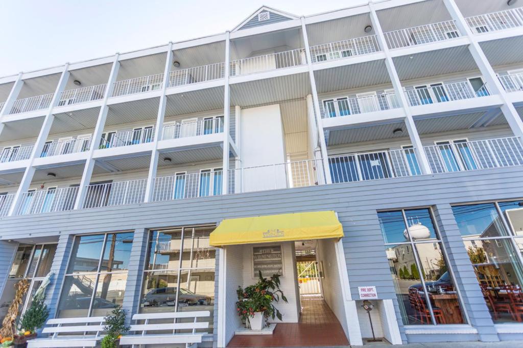 an exterior view of a building with a yellow awning at Wilmington avenue 50 #312 in Rehoboth Beach