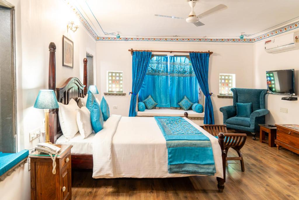 Een bed of bedden in een kamer bij Udaigarh - Udaipur