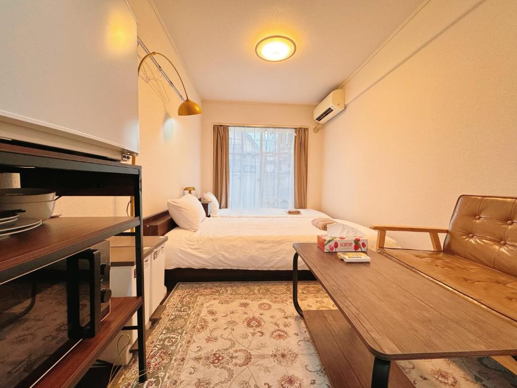 a small room with a bed and a window at Home Story in Tokyo Kanamachi&東京屋語 in Tokyo