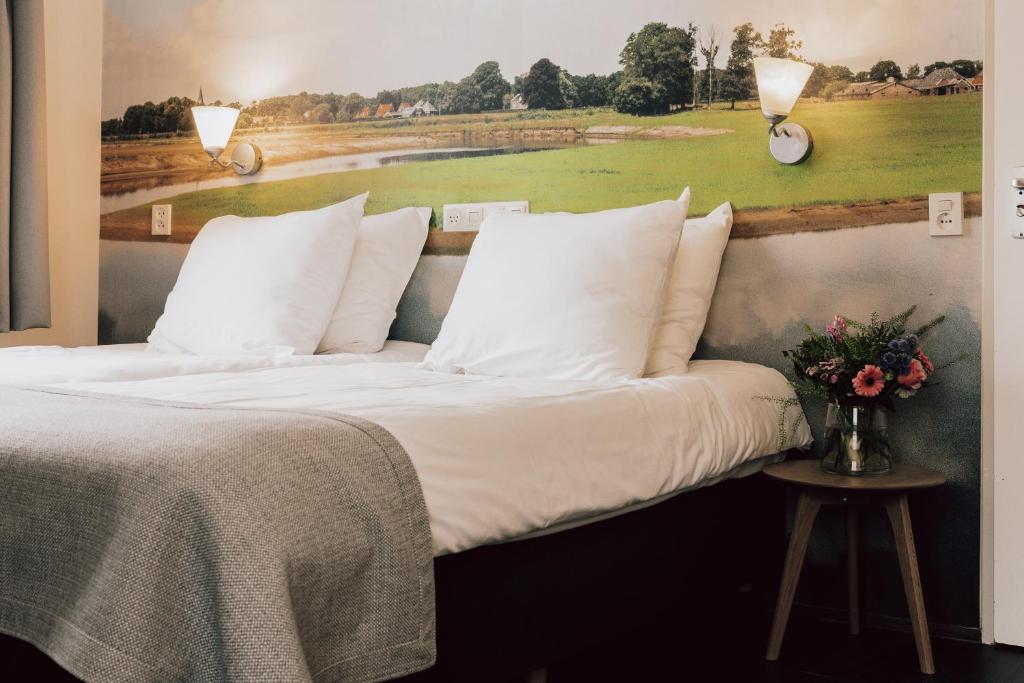 Postel nebo postele na pokoji v ubytování Landhotel De Hoofdige Boer