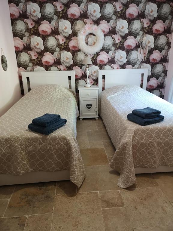 Postel nebo postele na pokoji v ubytování Le Mas des Agapes