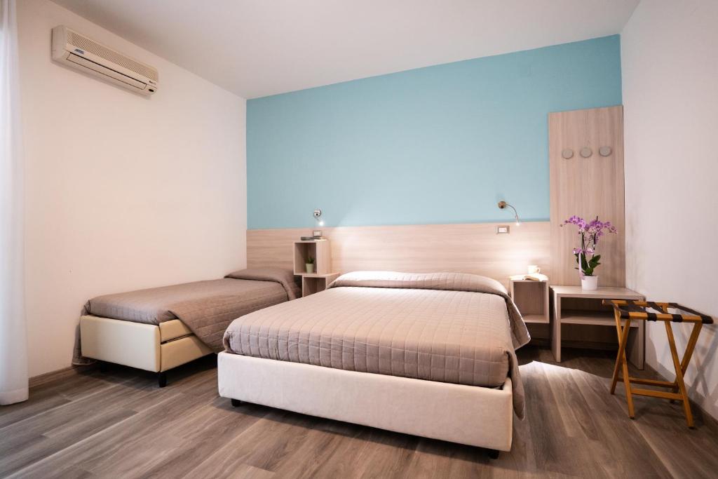 Postel nebo postele na pokoji v ubytování Hotel Marilinda
