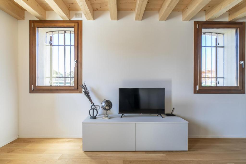 TV a/nebo společenská místnost v ubytování Molino 2 by WelcHome