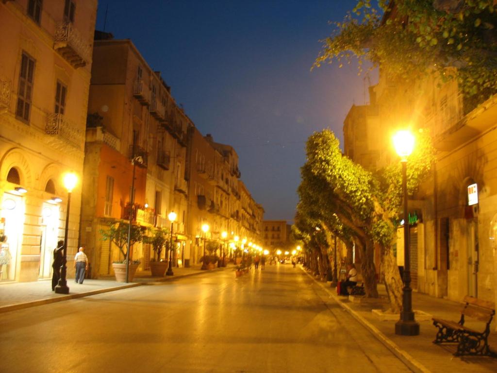 an empty city street at night with street lights at Case Vacanze Ancora in Porto Empedocle