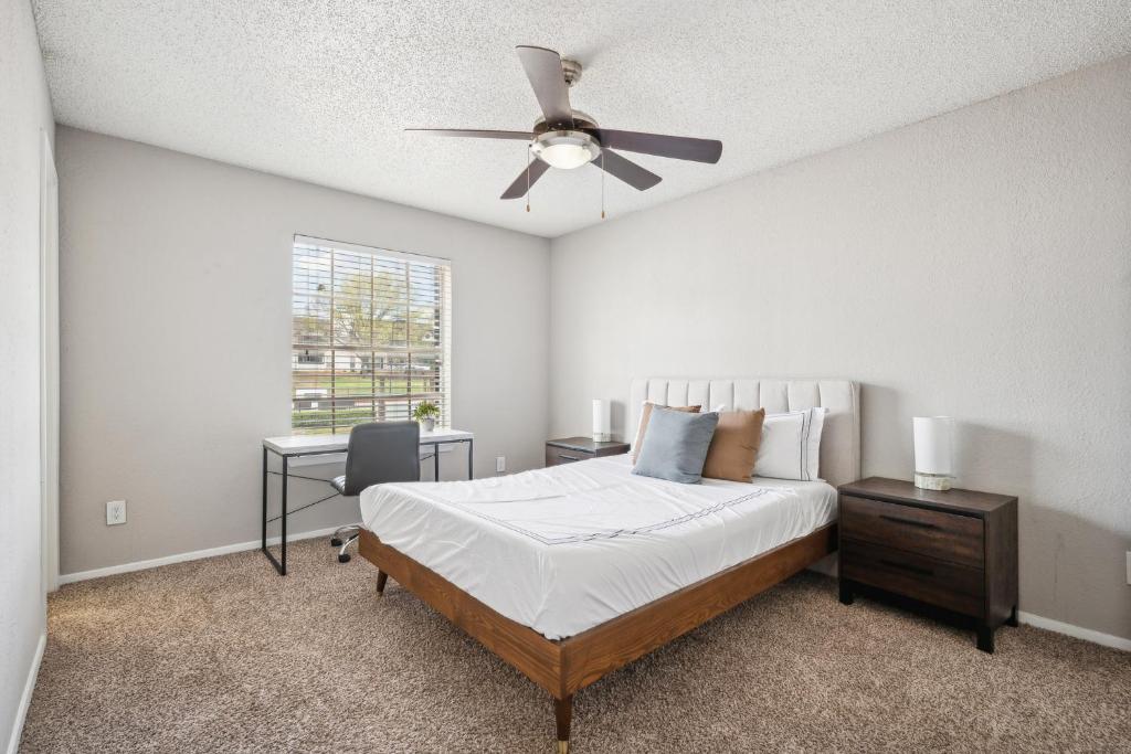 a bedroom with a bed and a ceiling fan at 3001 Crystal Springs 721 I Spacious 2 Bed 2 Bath in Bedford