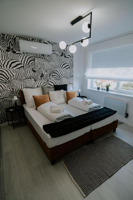 Postel nebo postele na pokoji v ubytování Maison de Luxe