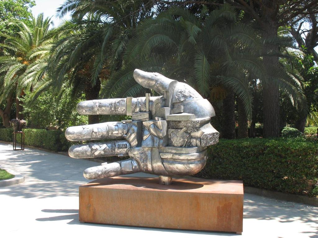 a statue of a person with their hands in the air at Case Vacanze Ancora in Porto Empedocle