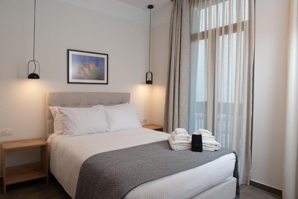 Postel nebo postele na pokoji v ubytování Evia Hotel