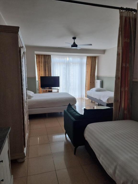 Postel nebo postele na pokoji v ubytování Aparthotel Résidence Bara Midi