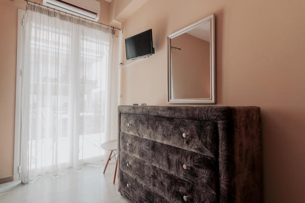 Telewizja i/lub zestaw kina domowego w obiekcie Family Holiday House In Nafplio