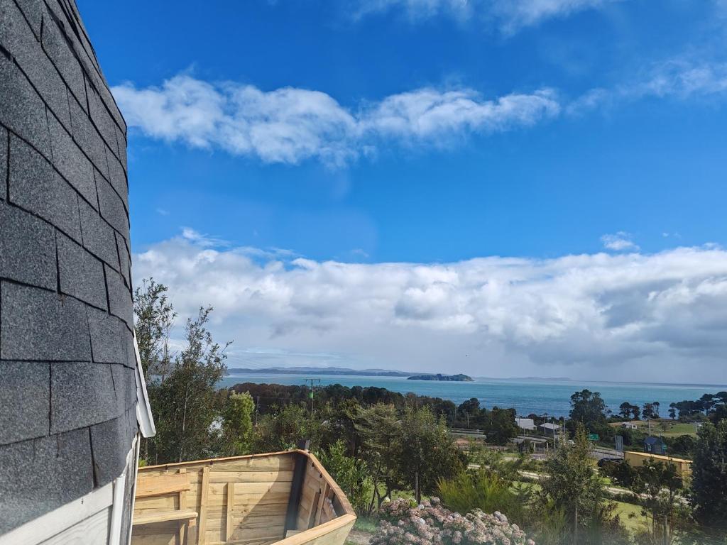 a view of the ocean from a house at domoschiloe in Ancud