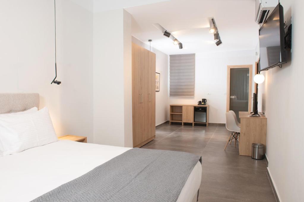 Postel nebo postele na pokoji v ubytování Evia Hotel