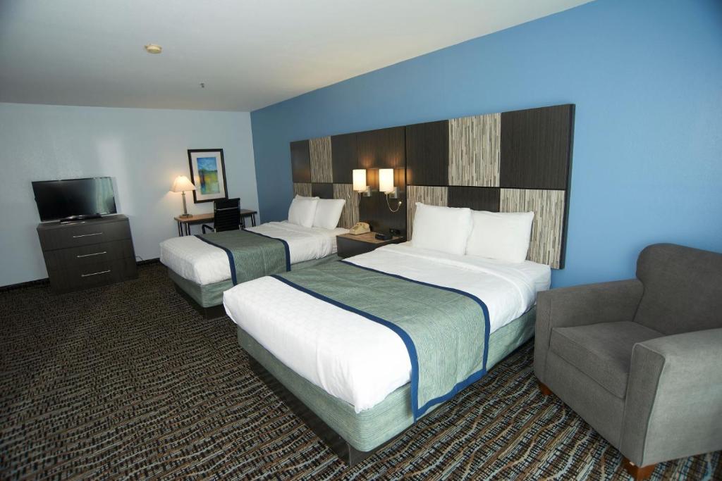 a hotel room with two beds and a couch at Sandwich Lodge & Resort in Sandwich