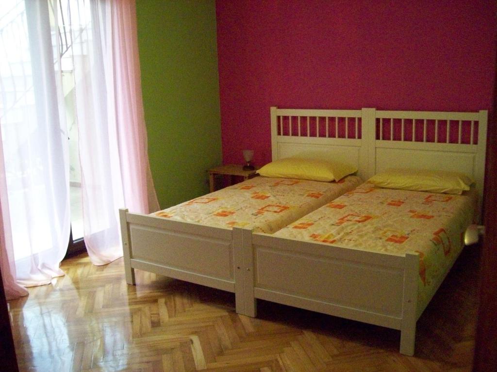 Postel nebo postele na pokoji v ubytování Apartment Monfiorenzo 11