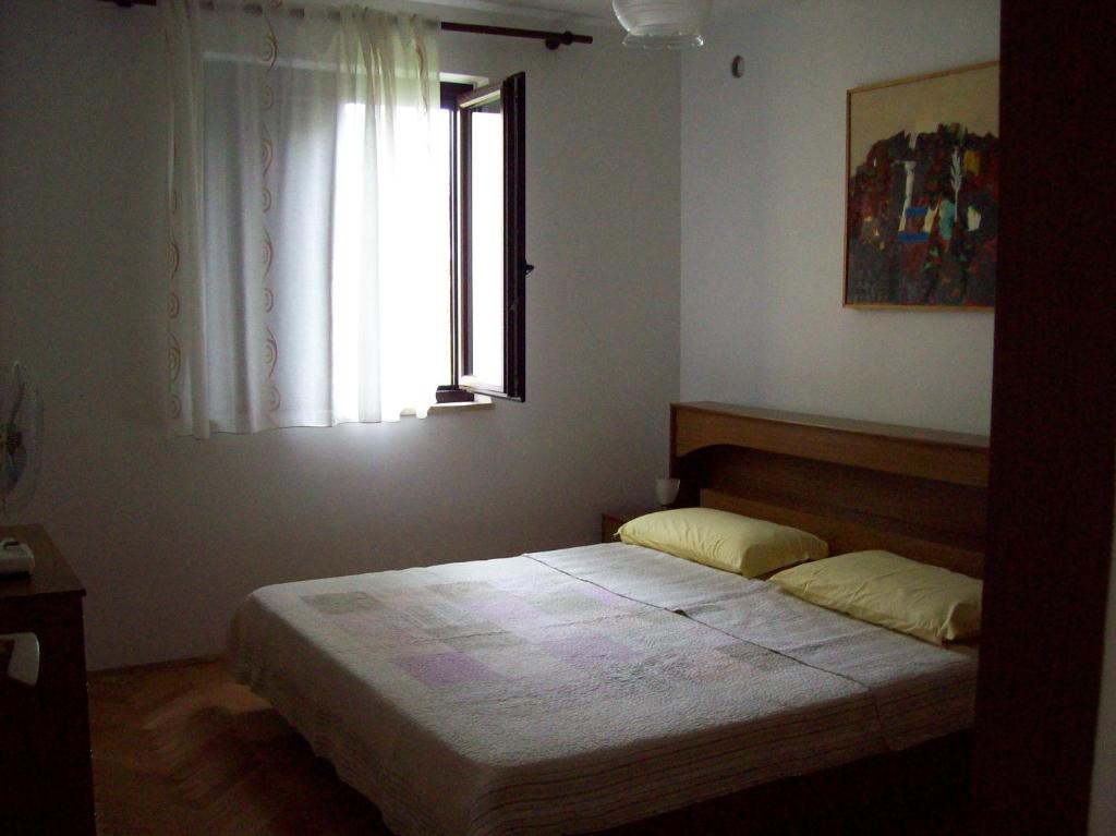 Postel nebo postele na pokoji v ubytování Apartment Monfiorenzo 11