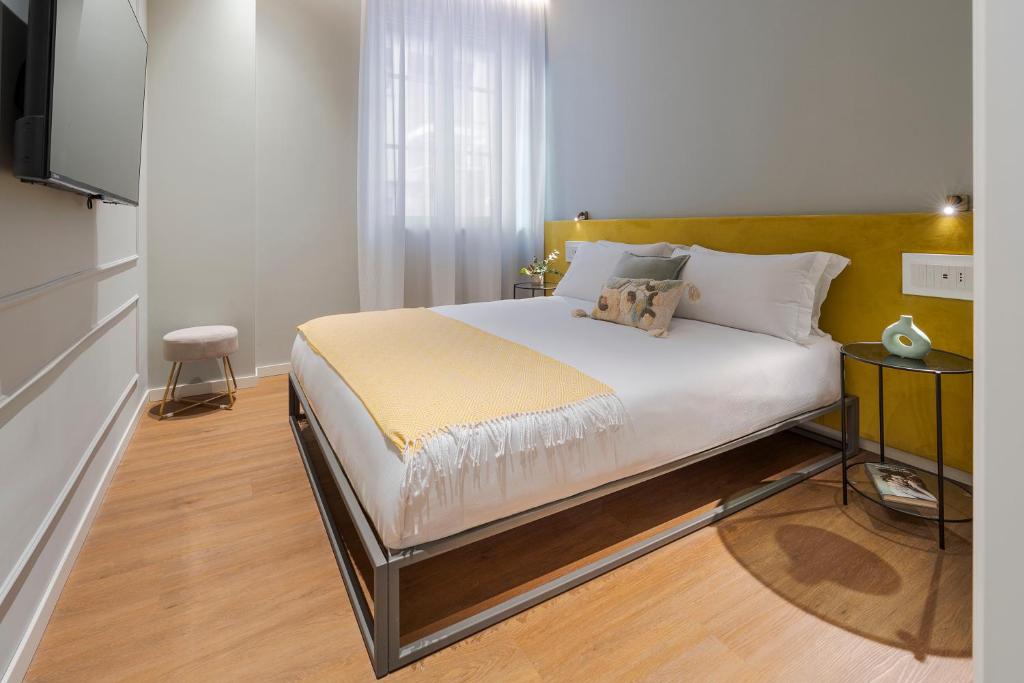 Letto o letti in una camera di Elysium Boutique Apartments - Catania
