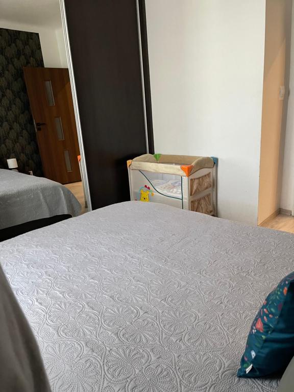 Posteľ alebo postele v izbe v ubytovaní Centrum Apartment Lipowa 12