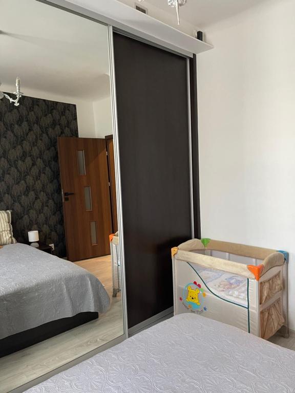 Posteľ alebo postele v izbe v ubytovaní Centrum Apartment Lipowa 12