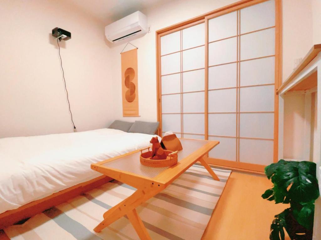 Postel nebo postele na pokoji v ubytování home story in Tokyo Okubo 東京屋語 in 新大久保 新宿