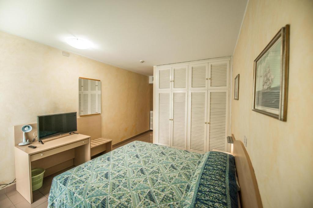 Postel nebo postele na pokoji v ubytování Hotel Johnson