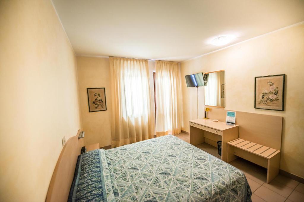 Postel nebo postele na pokoji v ubytování Hotel Johnson