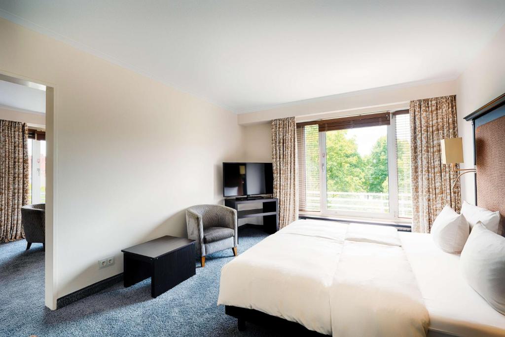 TV a/nebo společenská místnost v ubytování Radisson Blu Senator Hotel, Lübeck