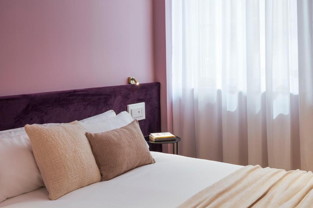 Letto o letti in una camera di Elysium Boutique Apartments - Catania