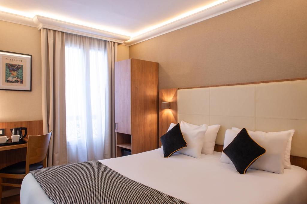 Ένα ή περισσότερα κρεβάτια σε δωμάτιο στο Hotel Cactus