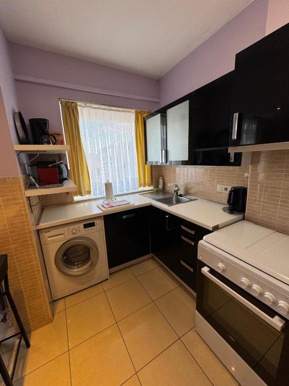 Kuchyň nebo kuchyňský kout v ubytování Aparthotel Résidence Bara Midi