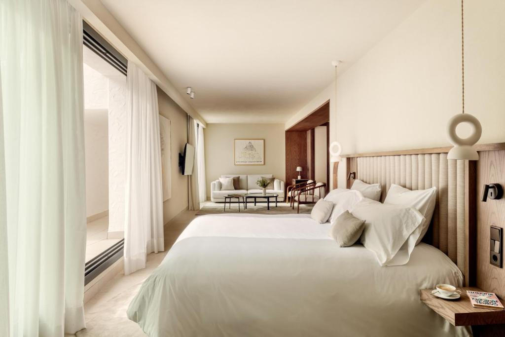 Posteľ alebo postele v izbe v ubytovaní Anfitrión Villas & Suites