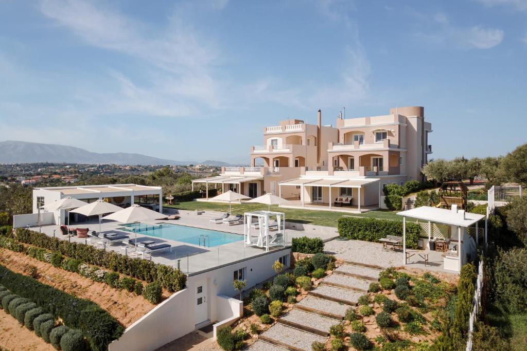 an aerial view of a villa with a swimming pool at Ema's Guest House in Porto Rafti