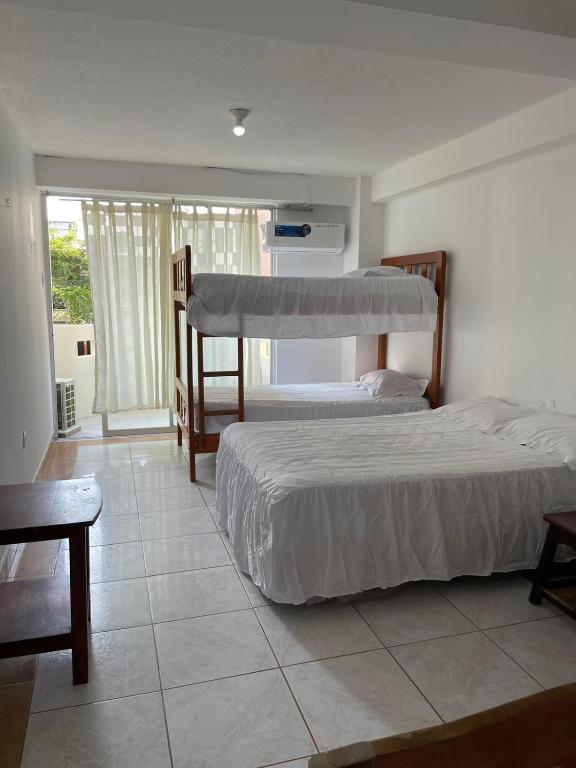 Postel nebo postele na pokoji v ubytování HOTEL PAL-MAR