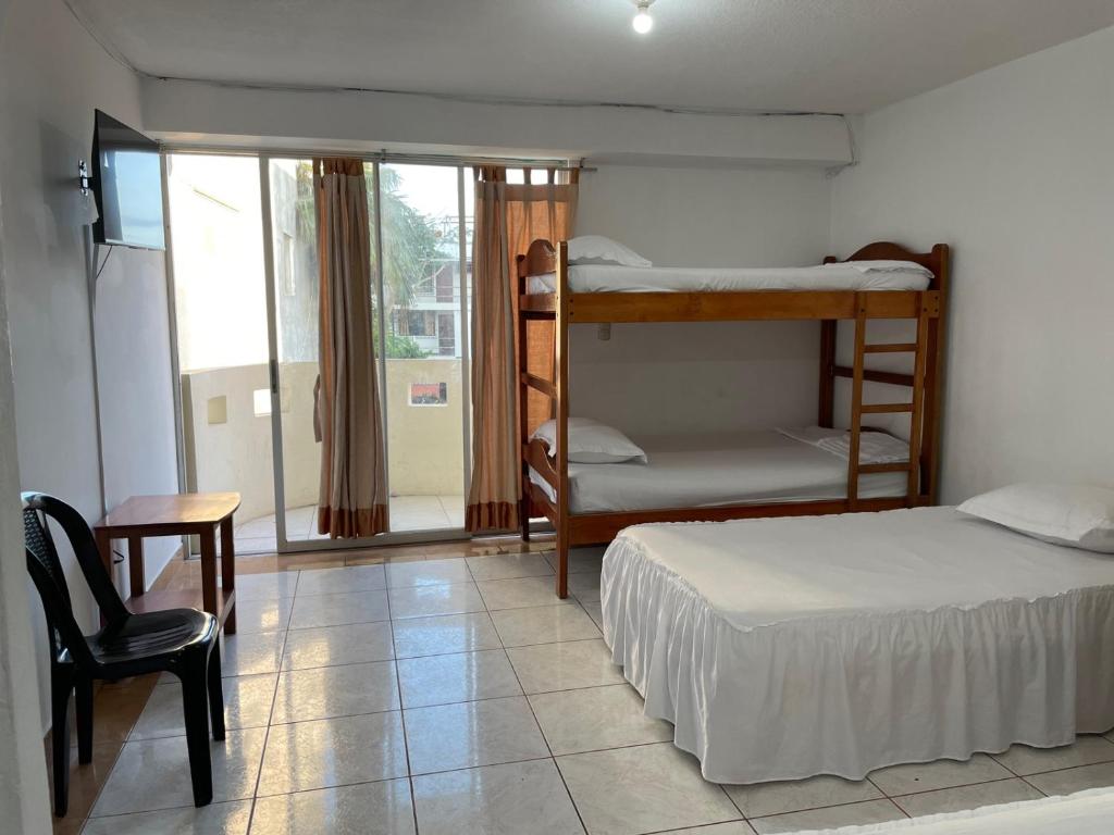Postel nebo postele na pokoji v ubytování HOTEL PAL-MAR